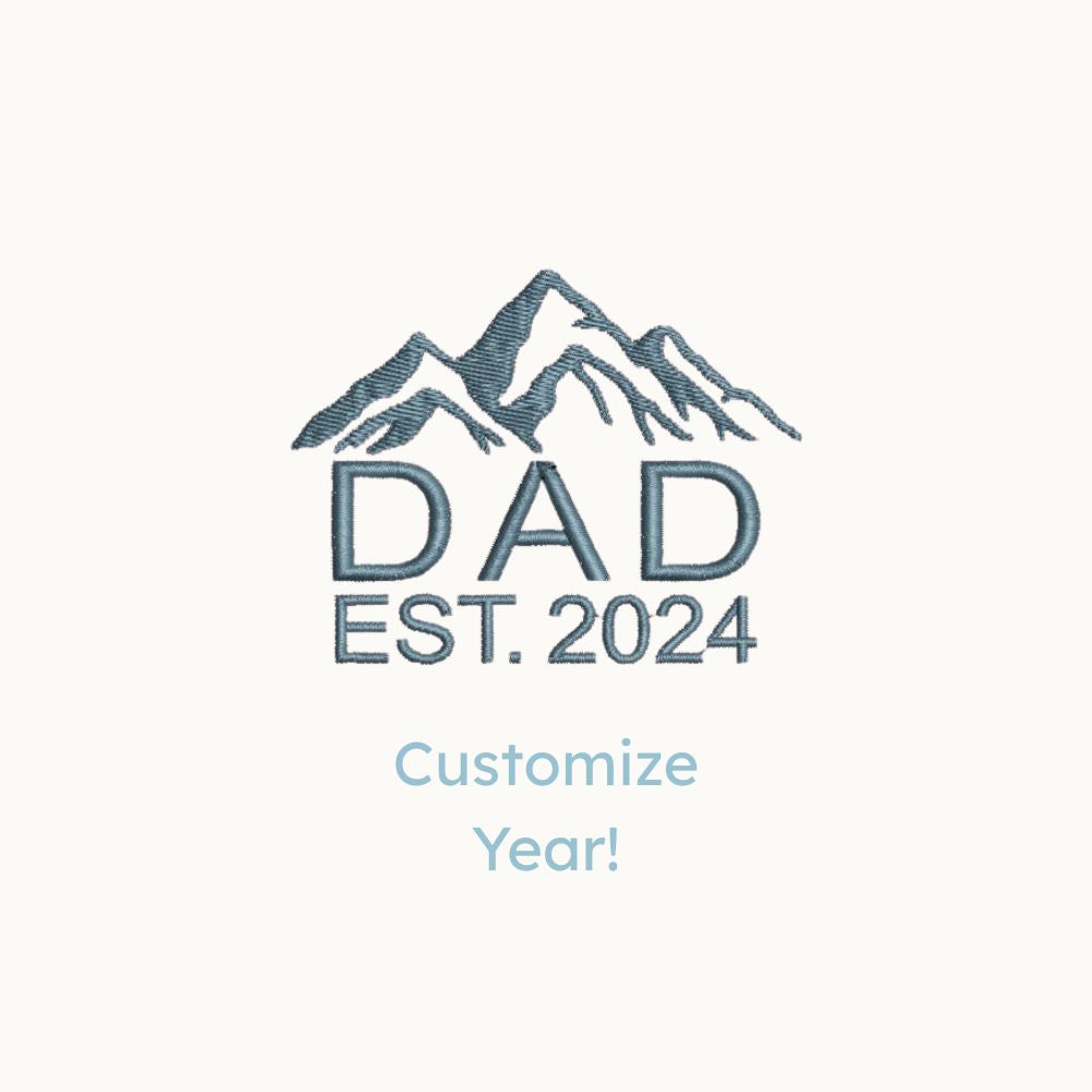 a mockup of a custom mountain icon and dad/custom year embroidered design