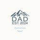 a mockup of a custom mountain icon and dad/custom year embroidered design