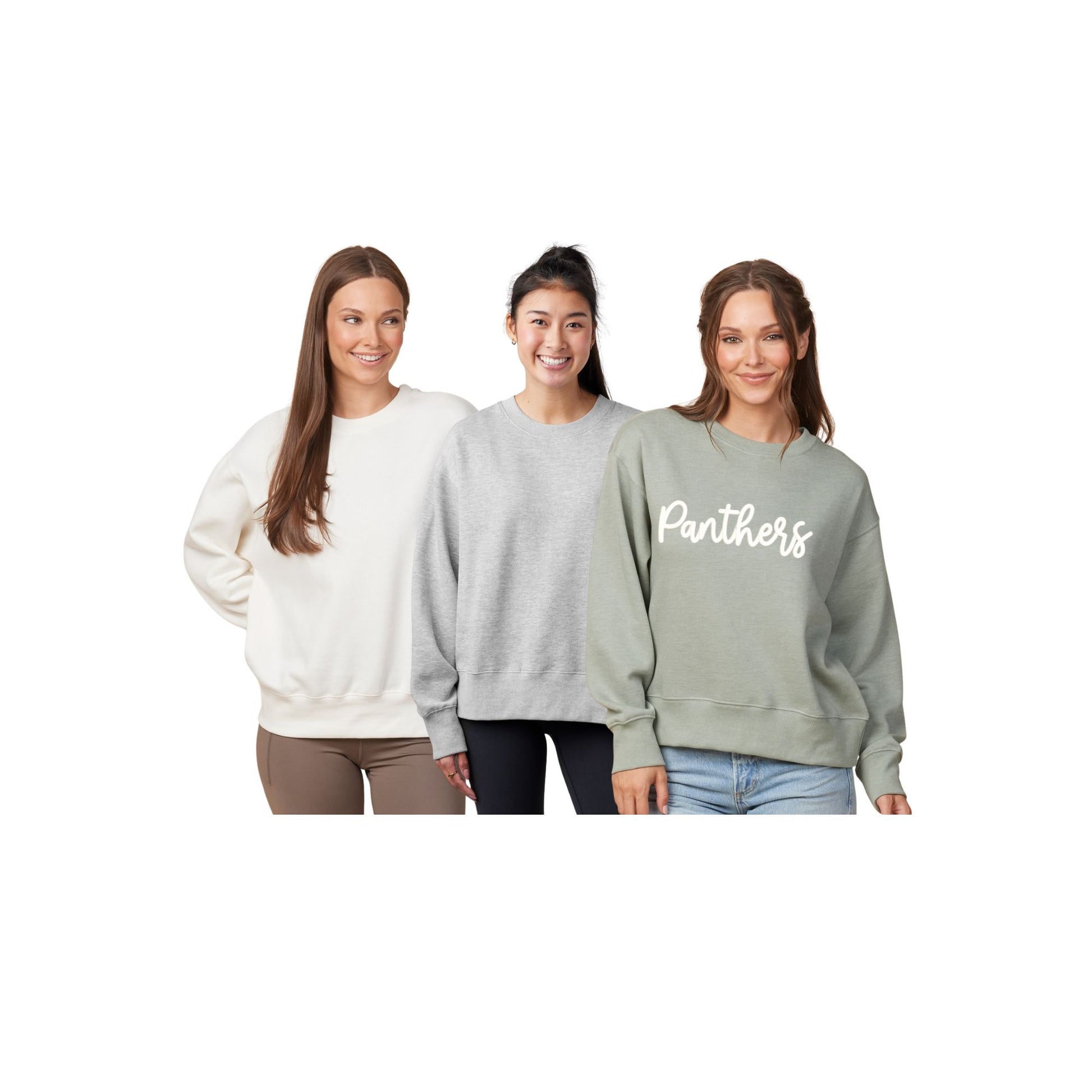 Three women wearing different colored sweatshirts on a white background