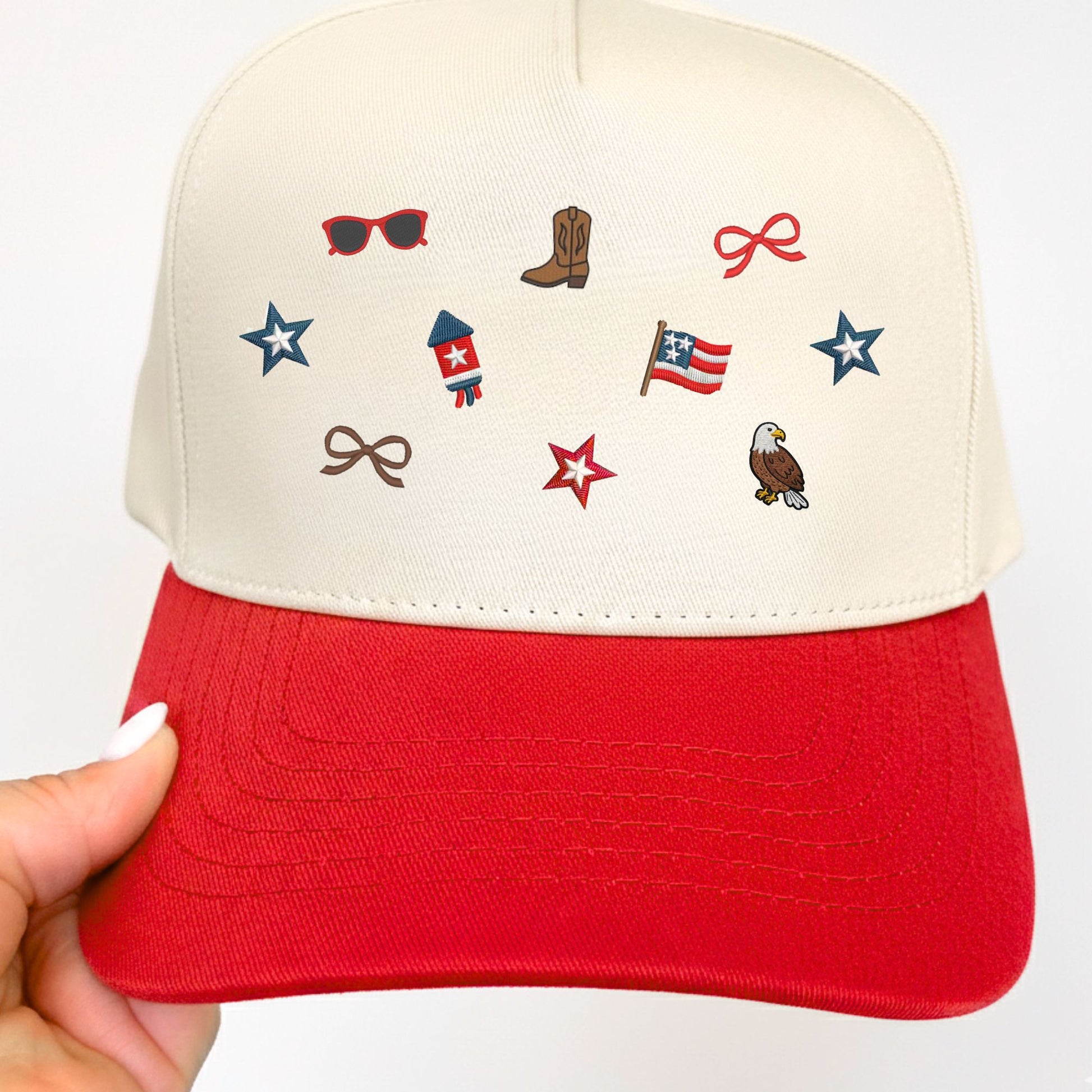 Red and white cap with embroidered micro usa icons on a white background