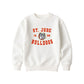 An off-white crewneck sweatshirt featuring a red and gray graphic print on the front that reads 'ST. JUDE BULLDOGS 1958' with a bulldog mascot illustration.