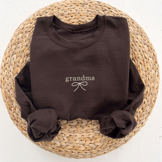 dark chocolate crewneck with custom name/dainty bow embroidered design on the center chest