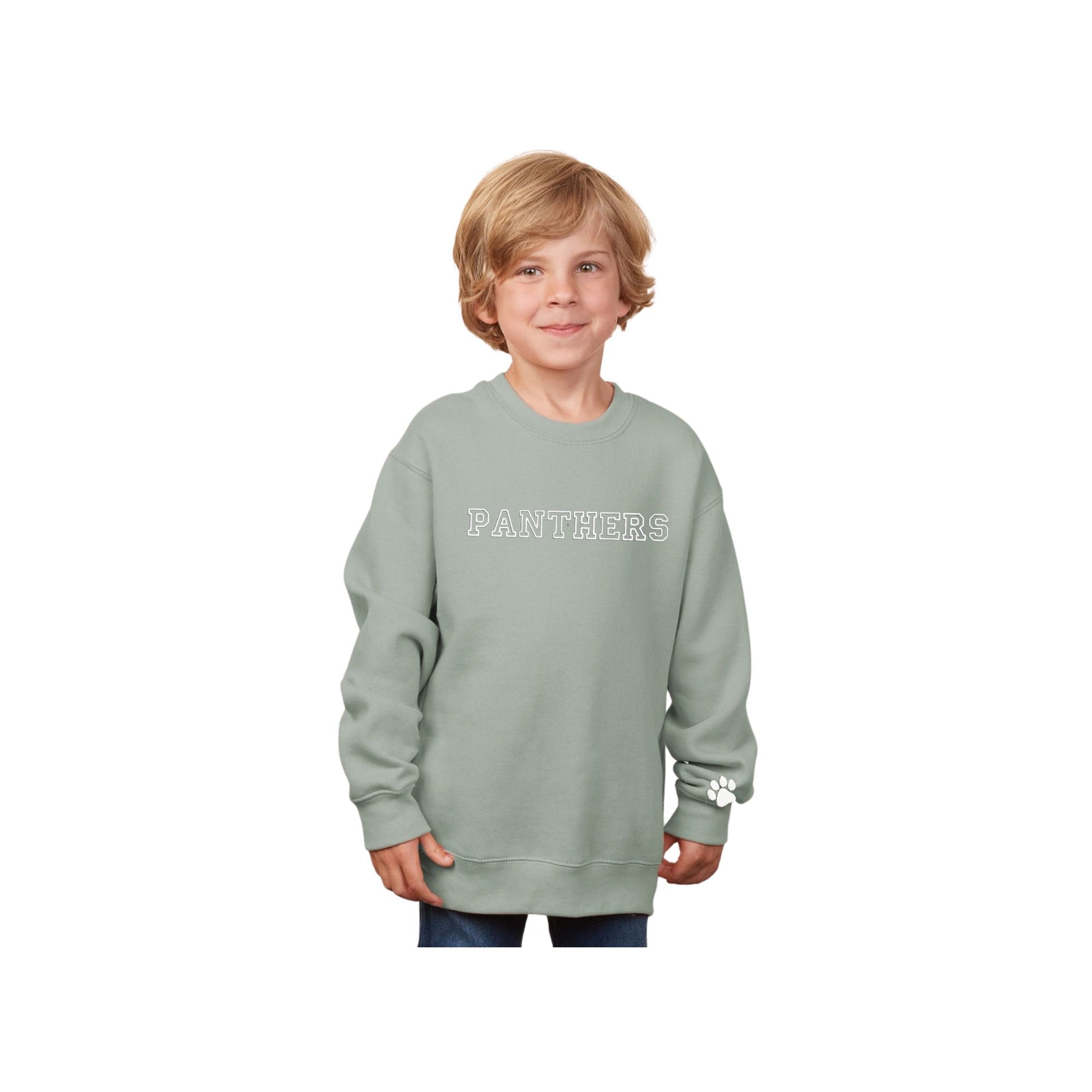 little boy wearing a greenstone youth sweatshirt with PANTHERS embroidered in an outlined varsity font and white thread on the center chest and a mini paw print on the left cuff