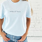 woman wearing a chambray comfort colors tee with custom mama embroidered design in a french blue thread