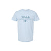 A light blue short-sleeve crewneck t-shirt with a dark blue graphic print on the chest reading 'VILLA MADONNA MONTESSORI 1971'.