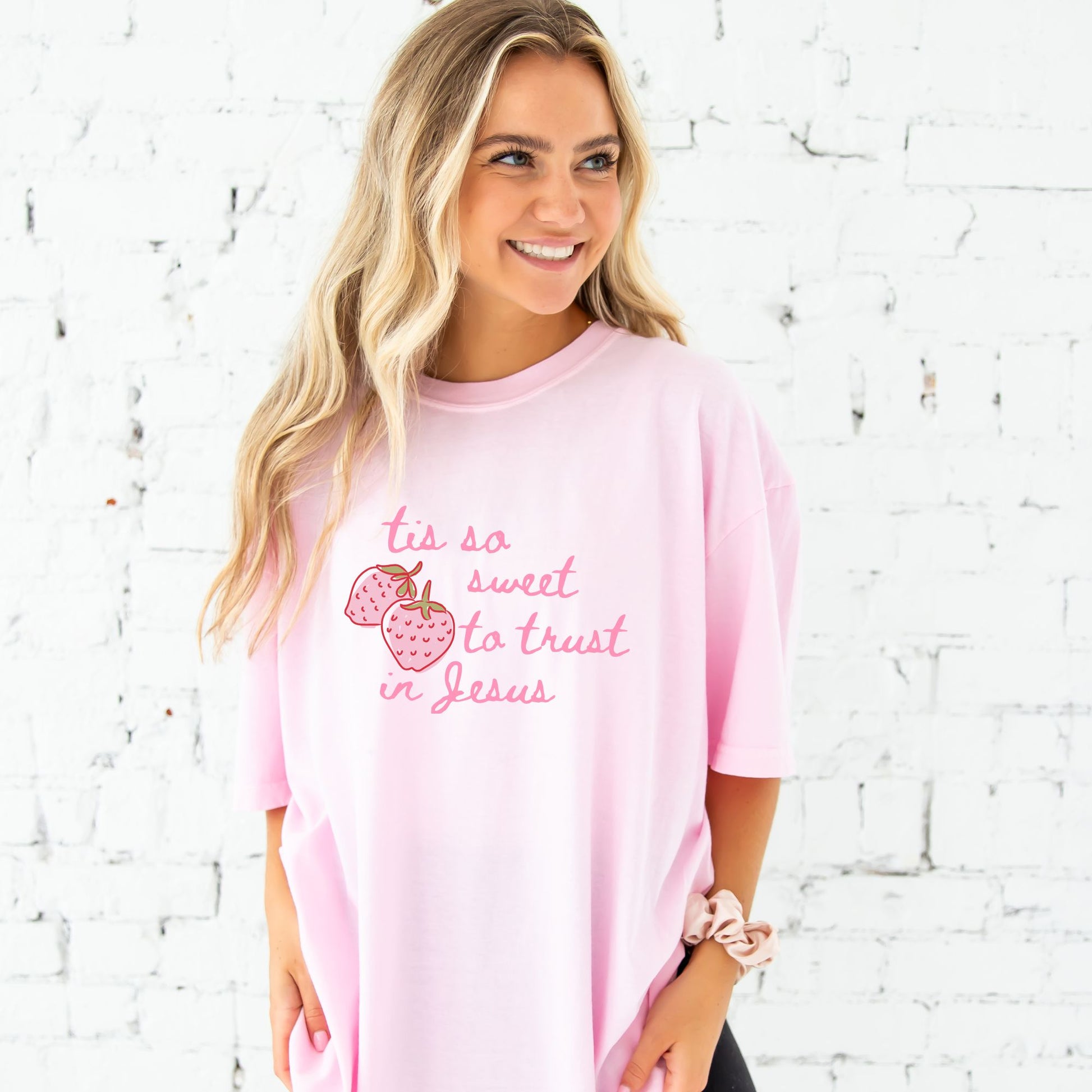 girl wearing a blossom comfort colors t-shirt with custom tis so sweet to trust in jesus strawberry print design