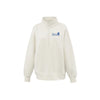 An off-white quarter-zip sweatshirt with a blue 'Villa Madonna Montessori' logo printed on the left chest, displayed on a clean white background.