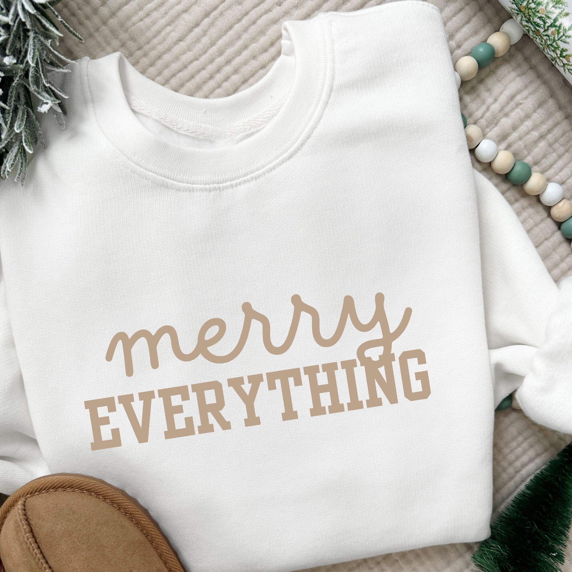 white crewneck youth sweatshirt with a merry everything print in tan