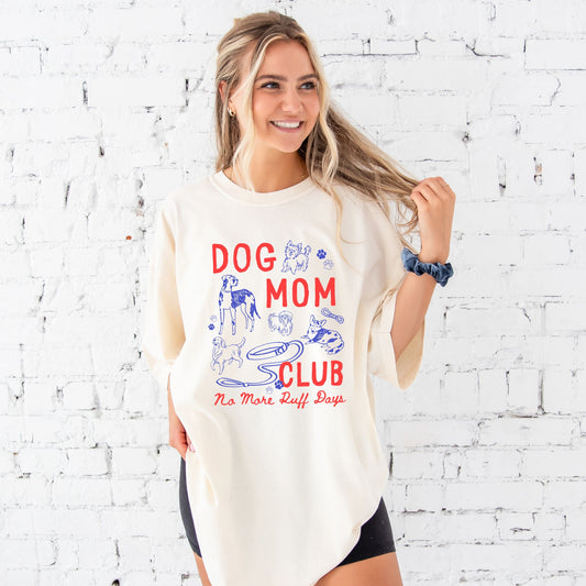 girl wearing oversized ivory comfort colors t-shirt with a large dog mom club dog doodle print 