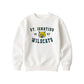 A bleached linen crewneck sweatshirt featuring a St. Ignatius Wildcats graphic on the chest, displayed against a solid white background.