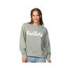 Woman wearing a green sweatshirt with 'Panthers' text on a white background