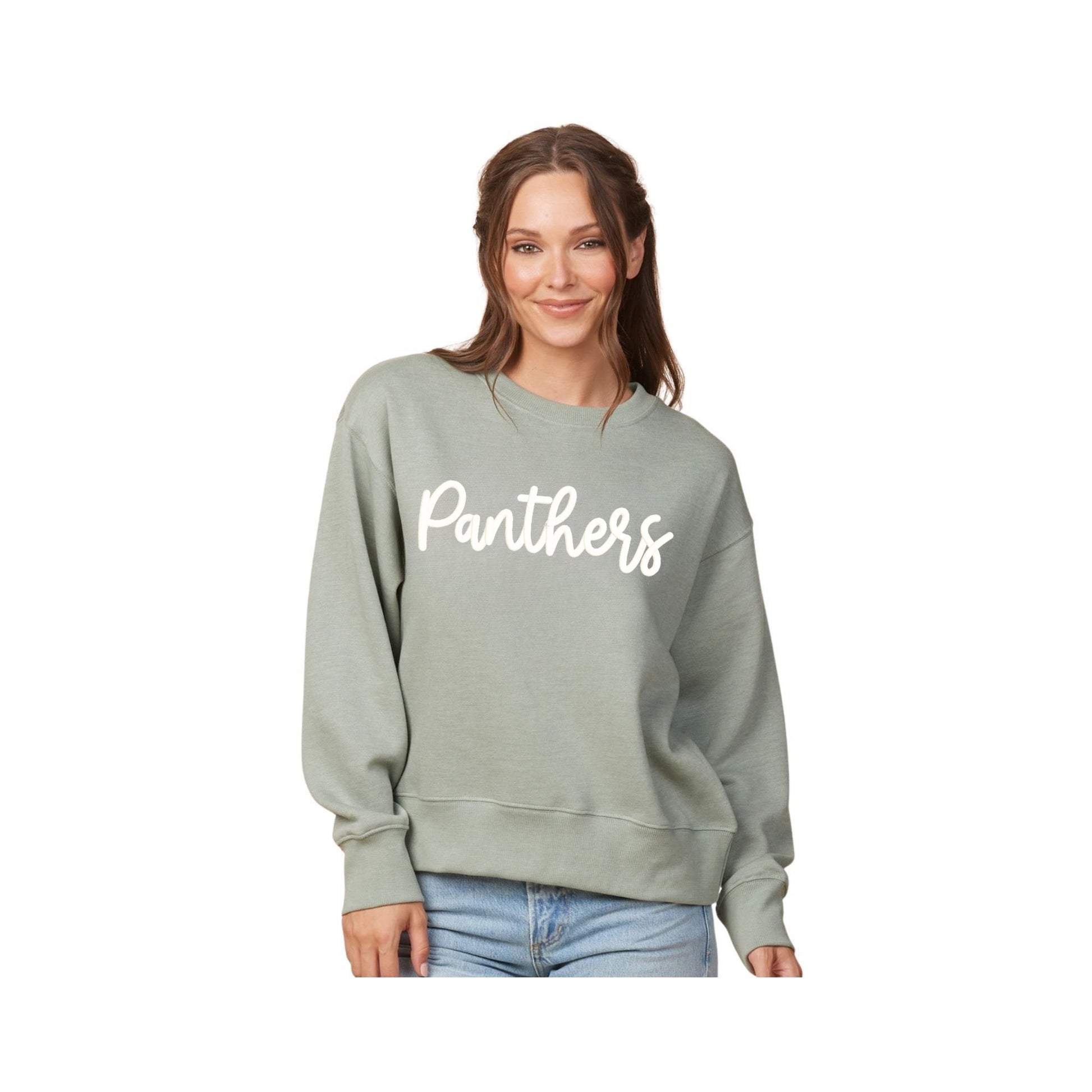 Woman wearing a green sweatshirt with 'Panthers' text on a white background