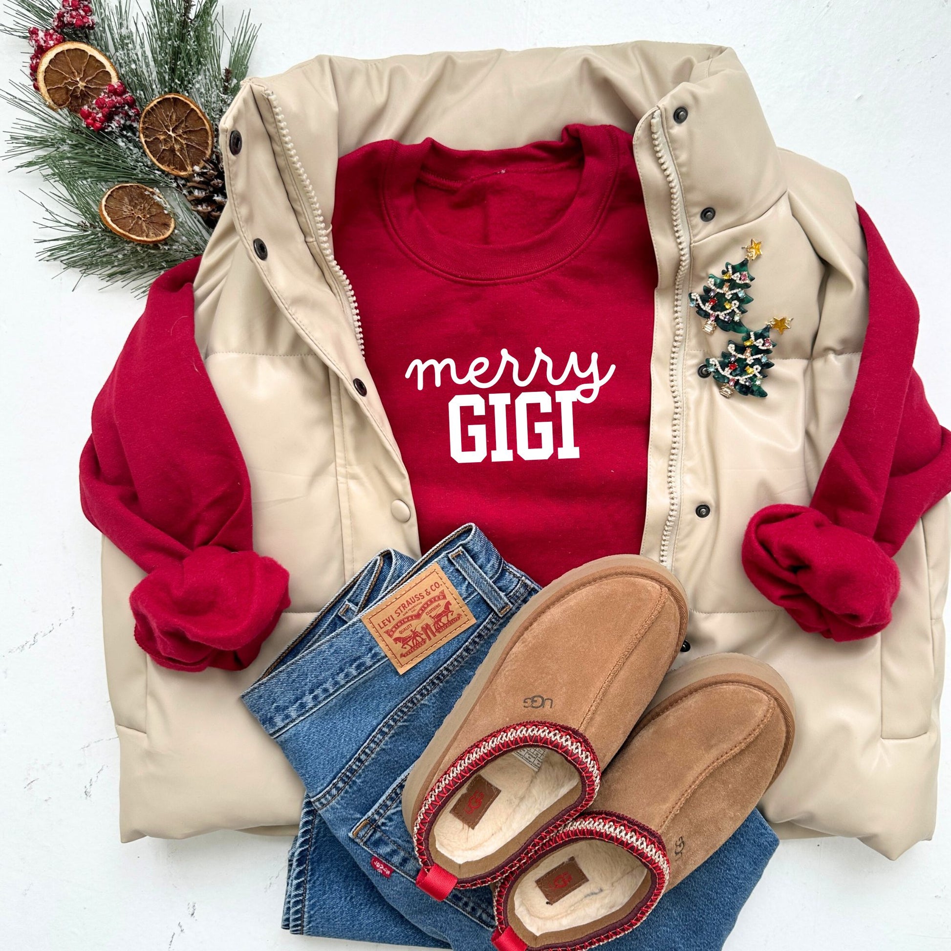 red crewneck sweatshirt with custom merry gigi print in white