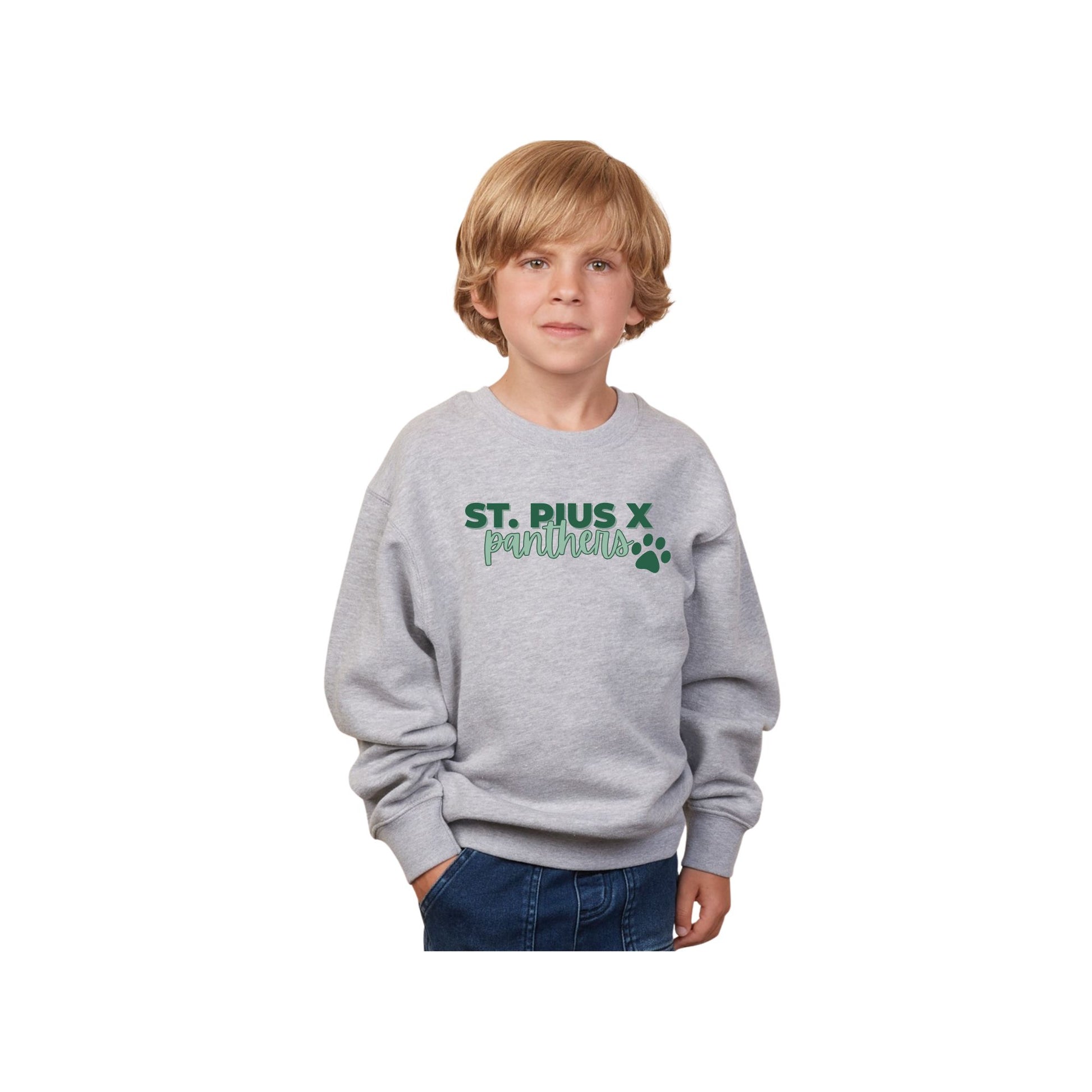 Child wearing a gray sweatshirt with 'St. Pius X' printed on it against a white background