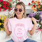 girl wearing a blossom comfort colors t-shirt with custom grow in grace floral frame printed design