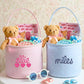 Two valentines baskets with custom name embroidery, stuffed with teddy bears, candies, and personalized cards on a floral background.