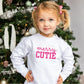 little girl wearing a white crewneck with a merry mini print in hot pink