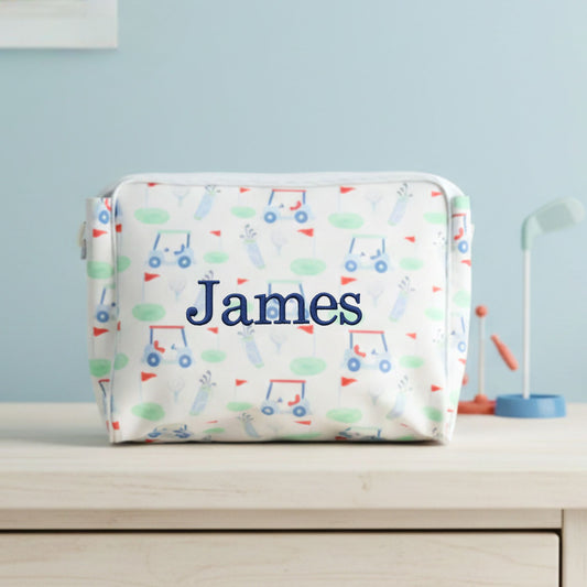 Personalized golf patterned pouch with 'James' embroidered on the front on a light blue background