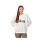 Woman wearing a white sweatshirt with 'others' printed on it against a white background