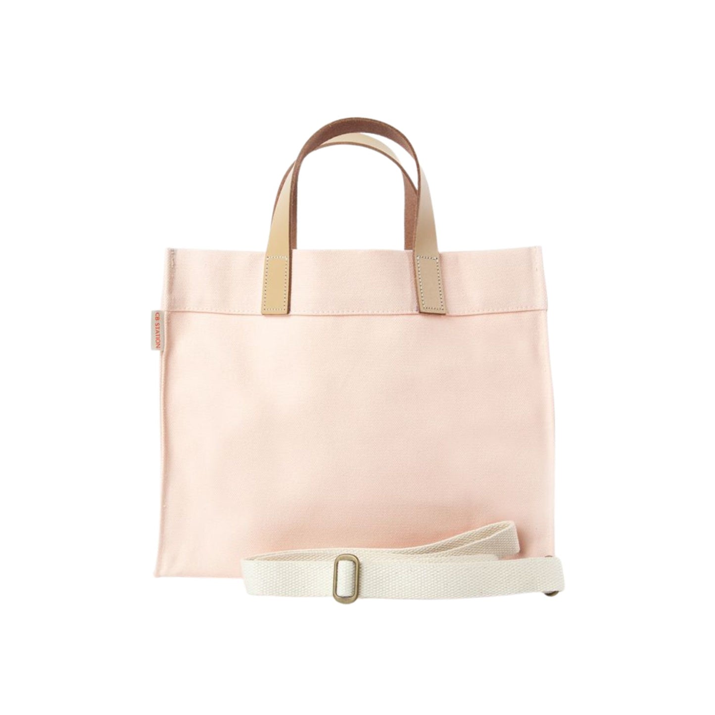 Pink tote bag with beige handles and strap on a white background