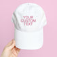 white hat with custom embroidered text in pink thread