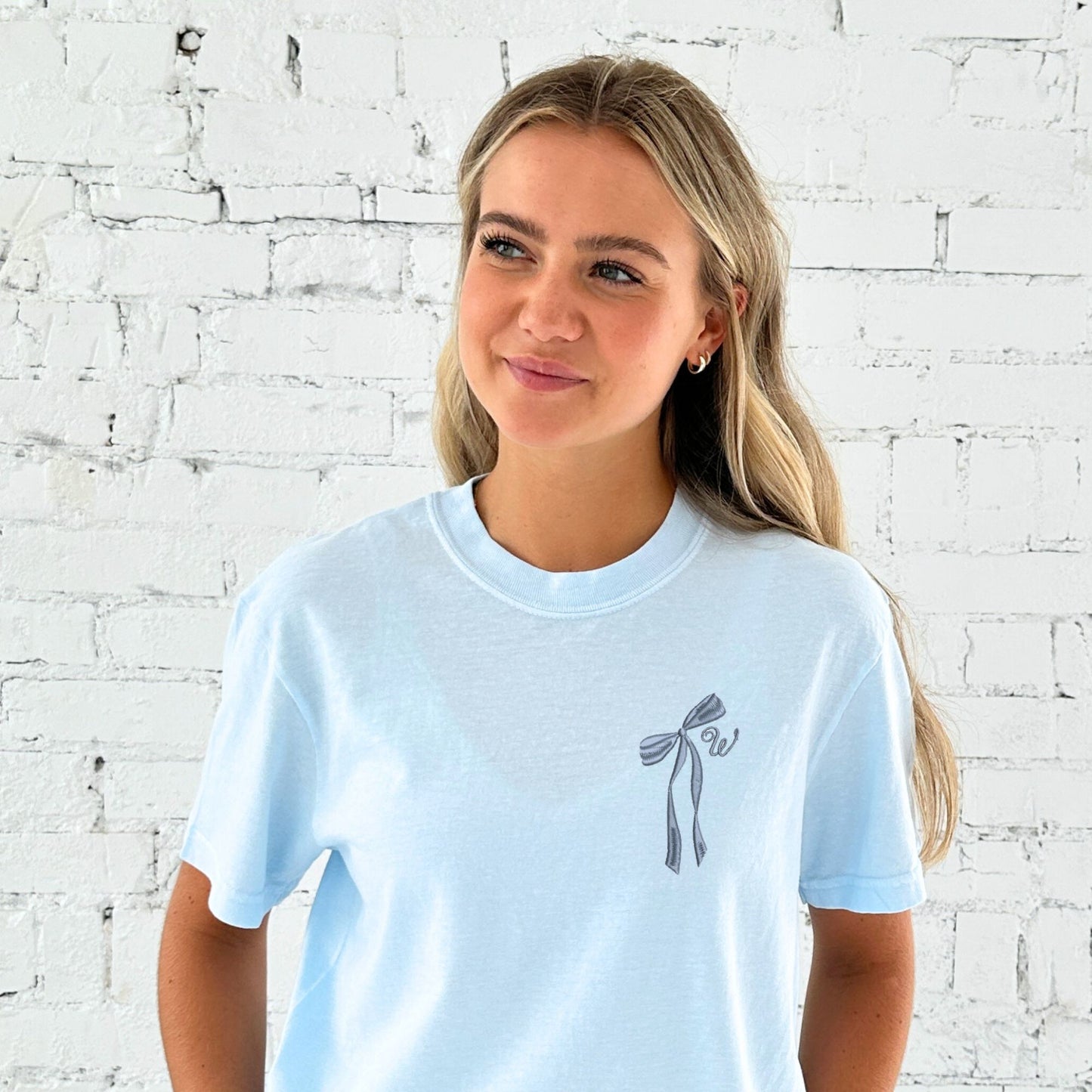 chambray comfort colors t-shirt with embroidered ribbon bow and cursive initial embroidered on the left chest in french blue thread