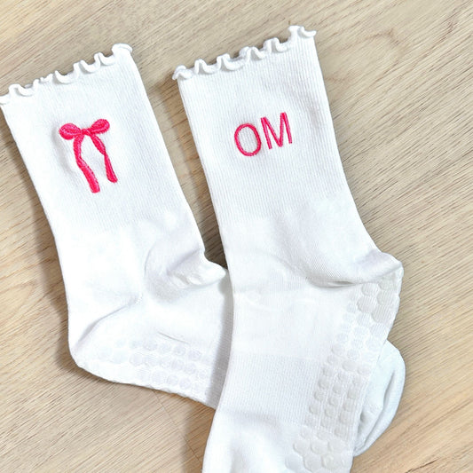 white ruffle grip socks with custom bow and initial embroidery in pink thread