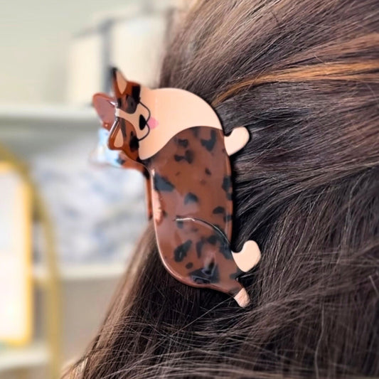 Hair clip with corgi design in a person's hair