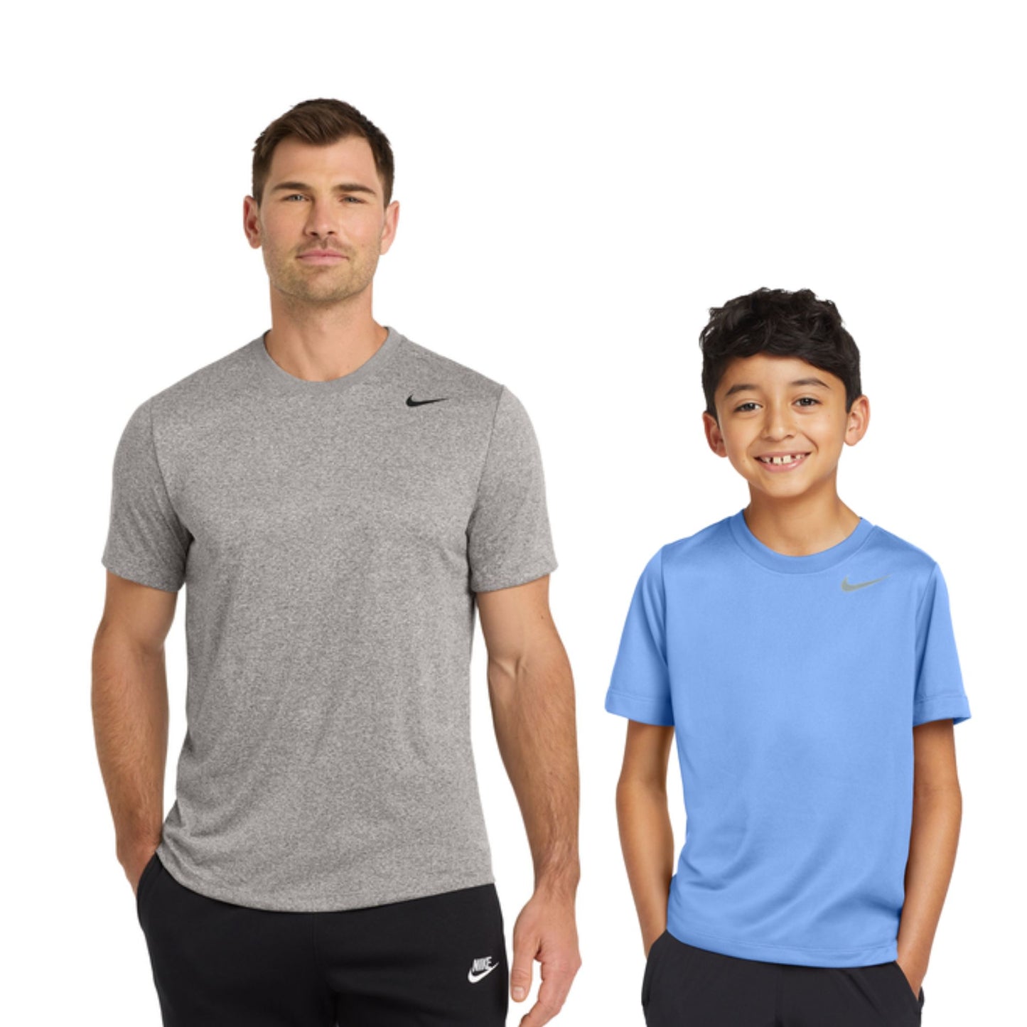 Man and boy wearing gray and blue Nike t-shirts on a white background