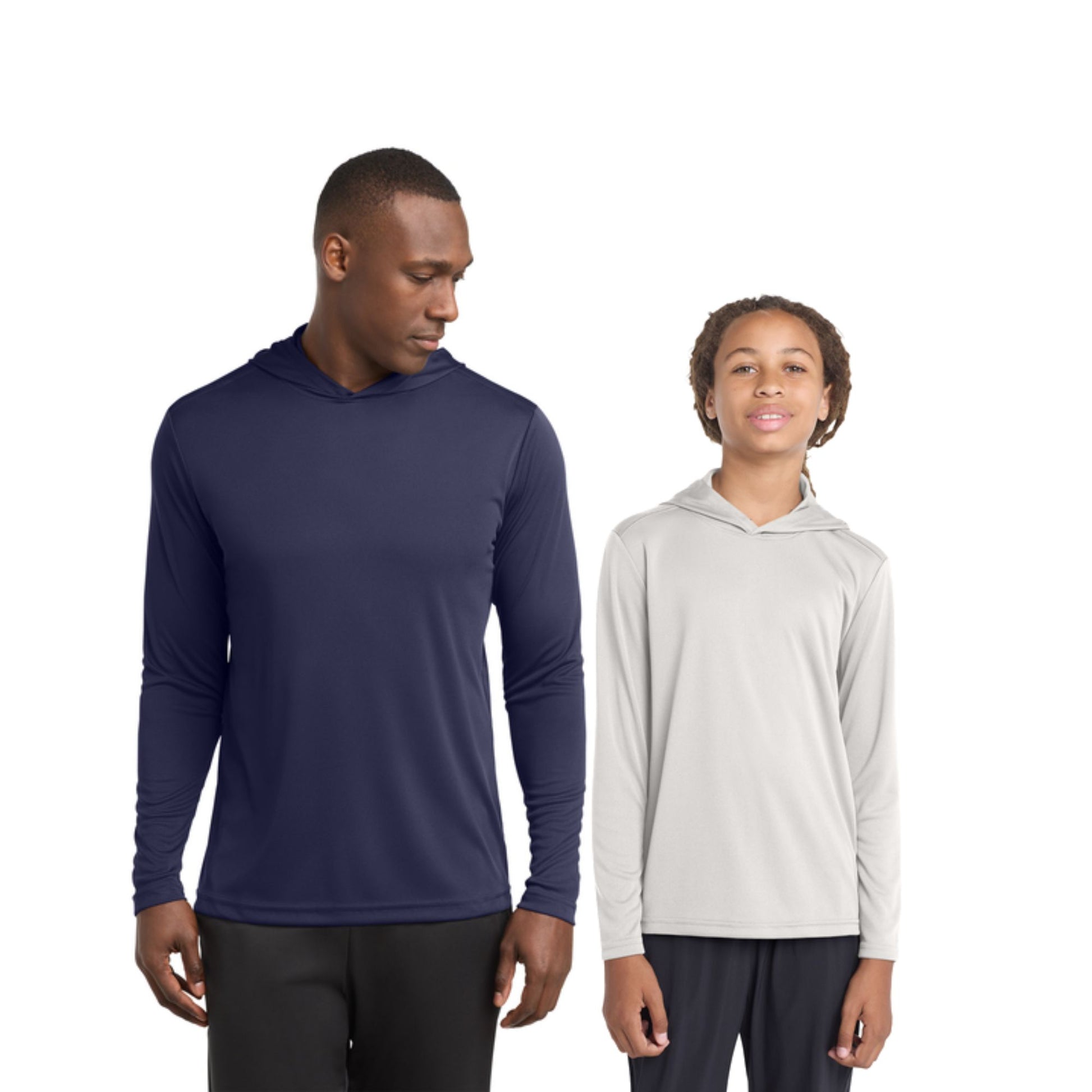 Two people wearing long-sleeve hoodies on a white background