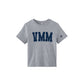 A heather gray short-sleeve crop top t-shirt featuring the letters 'VMM' printed in navy blue across the chest, with a small navy blue 'cross' logo on the right sleeve, shown against a plain white background.