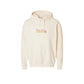 an ivory lightweight comfort colors hooded pullover with a custom name embroidered over an embroidered pencil icon on the center front of the shirt