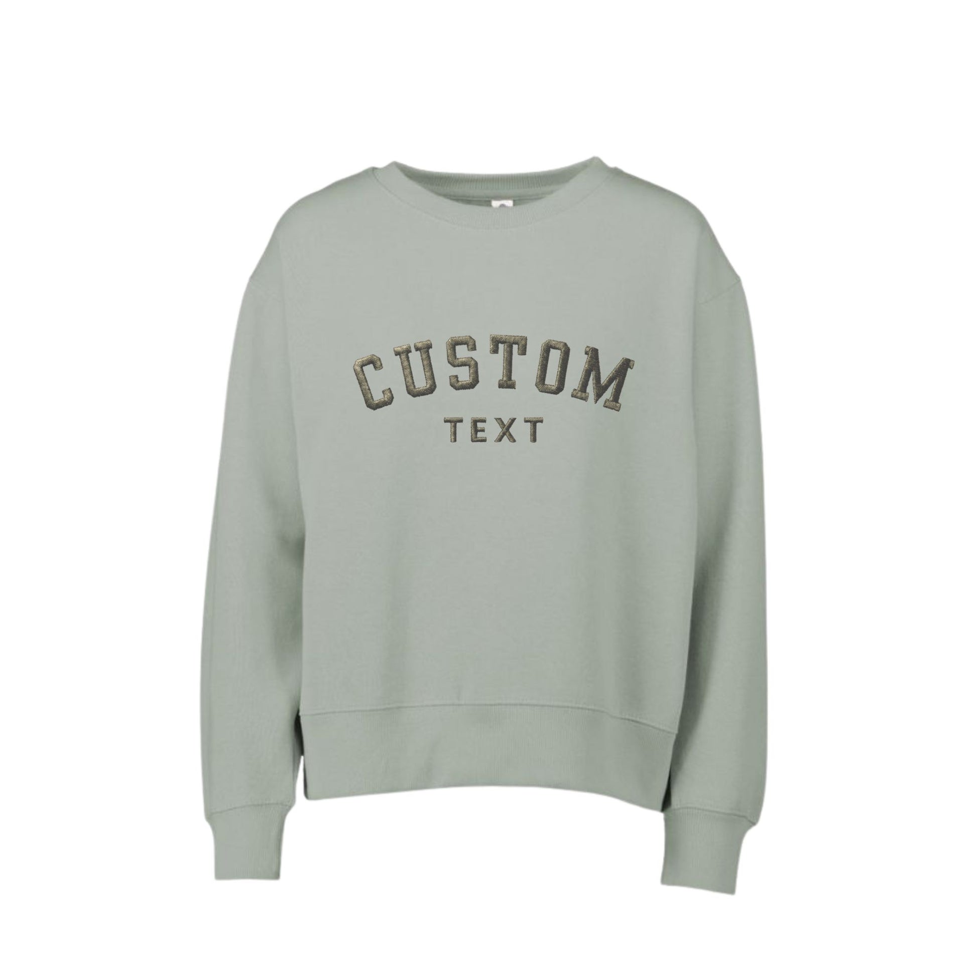 A greenstone crewneck sweatshirt with 'CUSTOM TEXT' embroidered in a dark brown arched font on the chest, displayed against a solid white background.