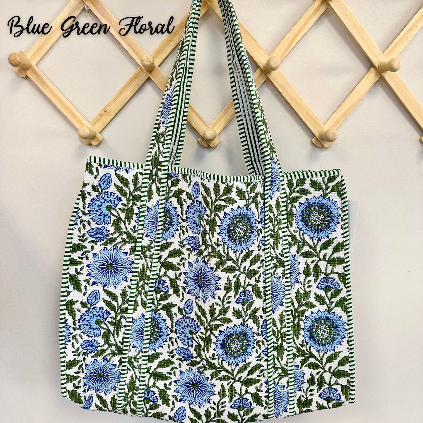 Floral-patterned bag with blue flowers on a white background