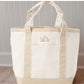 canvas tote bag with 'slr' monogram on a neutral background
