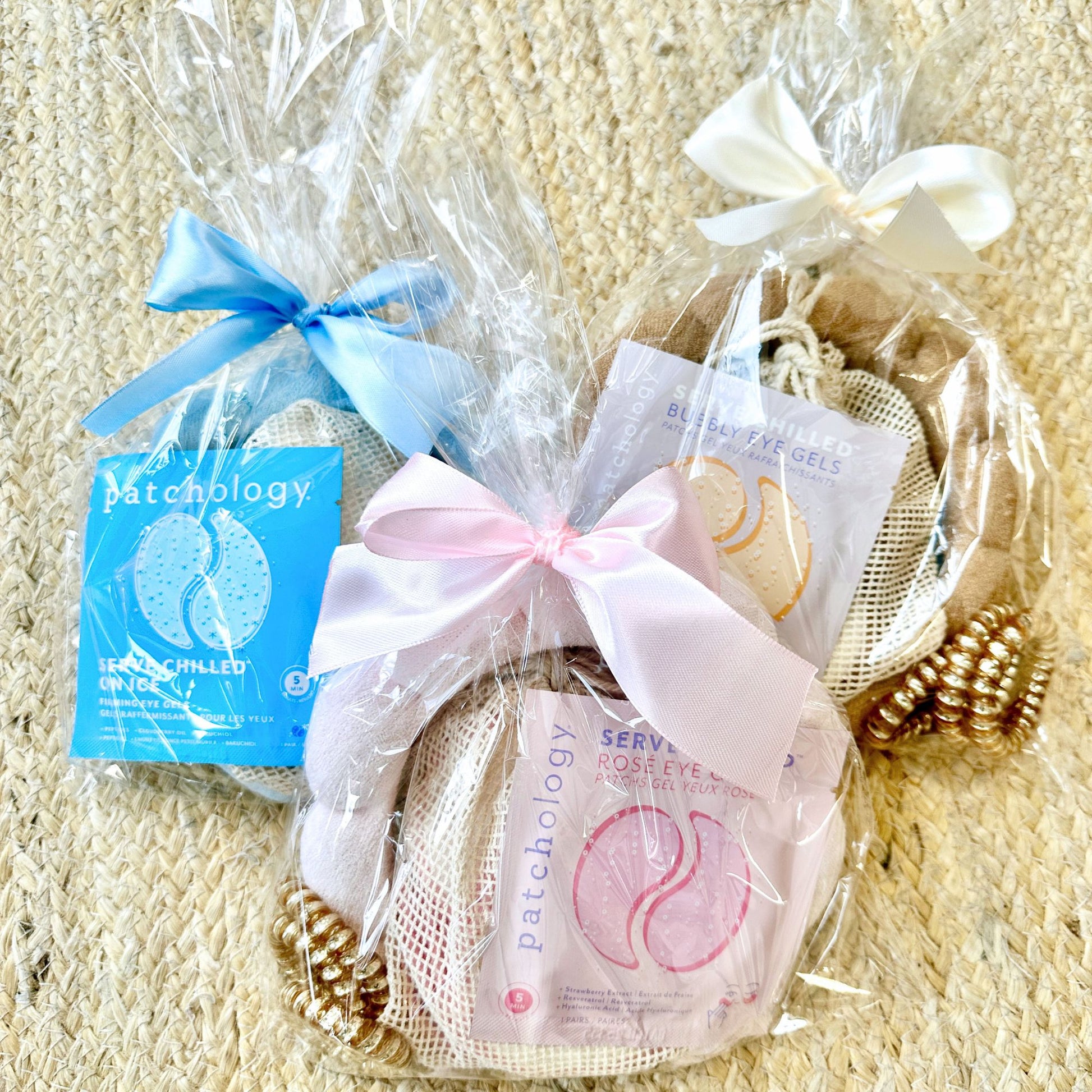 three custom spa bundles in blue, pink, and beige