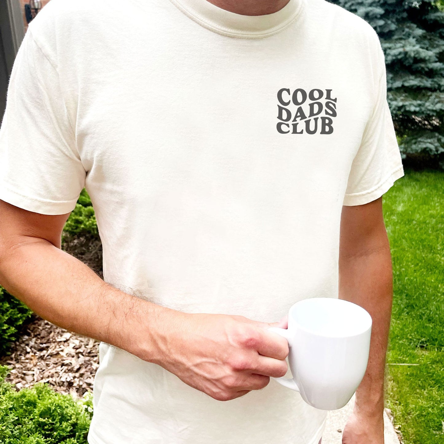man wearing an ivory comfort colors tee with wavy cool dads club print