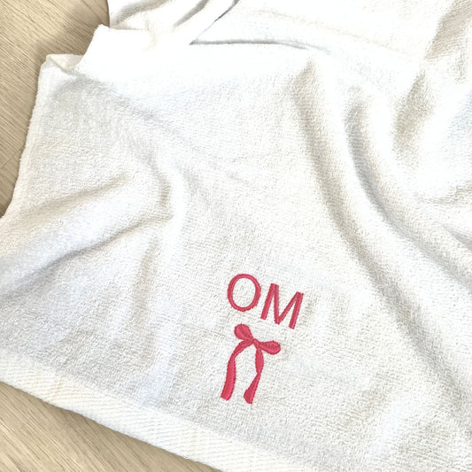 white gym hand towel with custom two letter and bow embroidered design in pink thread