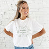 girl wearing a white comfort colors t-shirt with custom made to worship printed design featuring cute Christian themed drawn icons