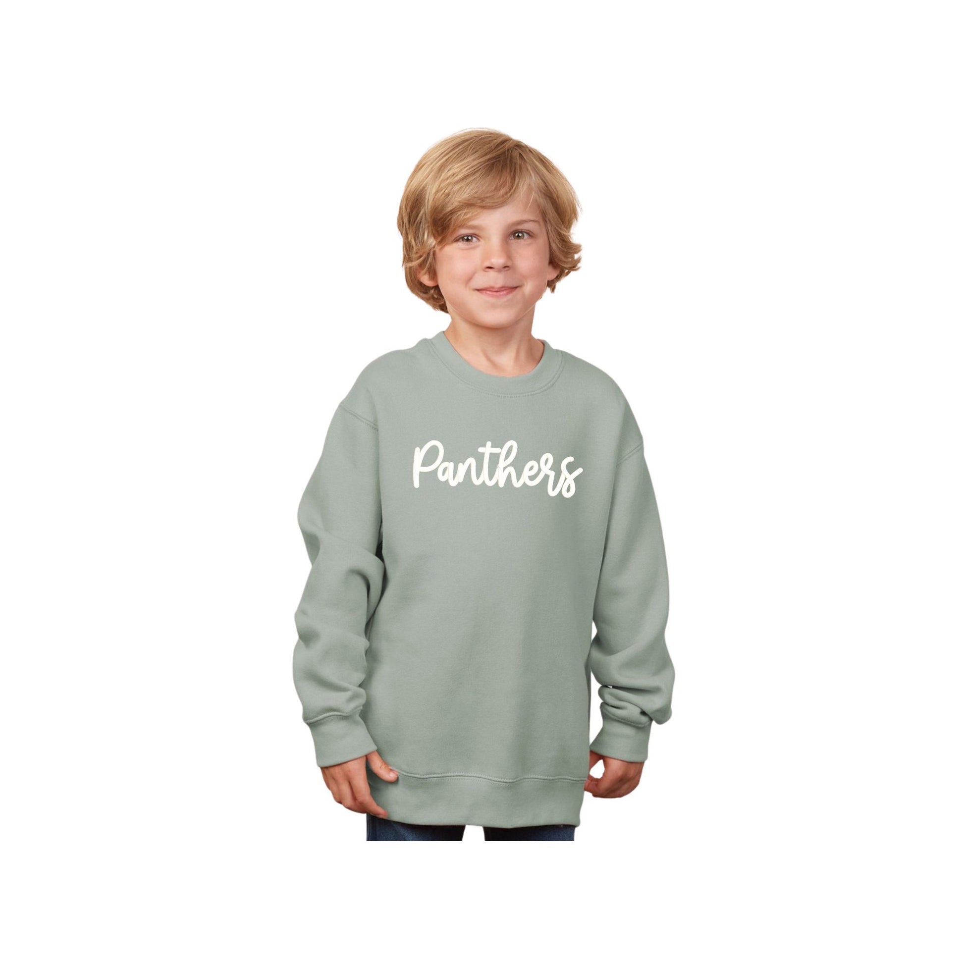 Child wearing a light green sweatshirt with 'Panthers' text on a white background