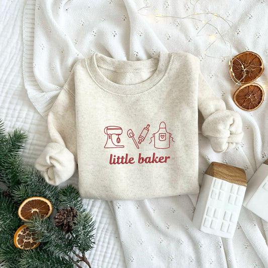 toddler heather oatmeal crewneck sweatshirt with embroidered baking icons and little baker text in red thread