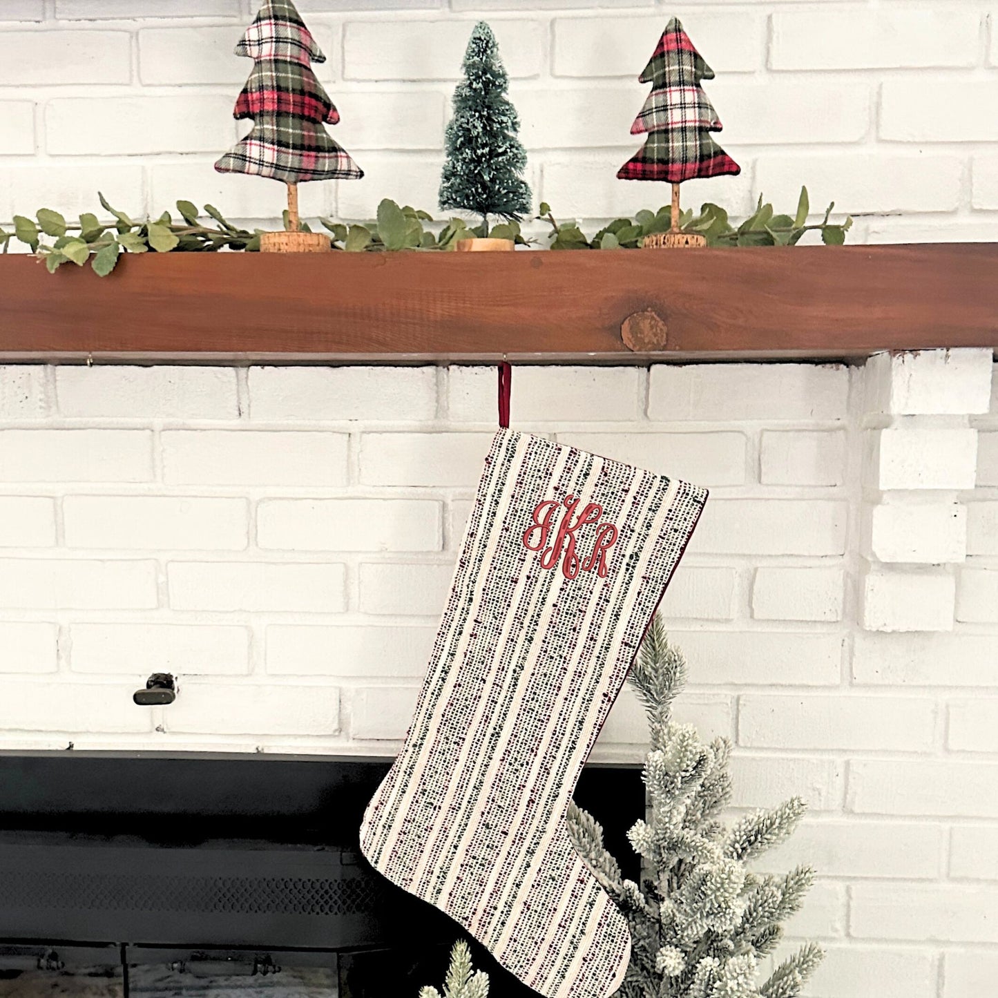 multi-striped textured red and green christmas stocking with custom monogram embroidery in font 3 and red thread