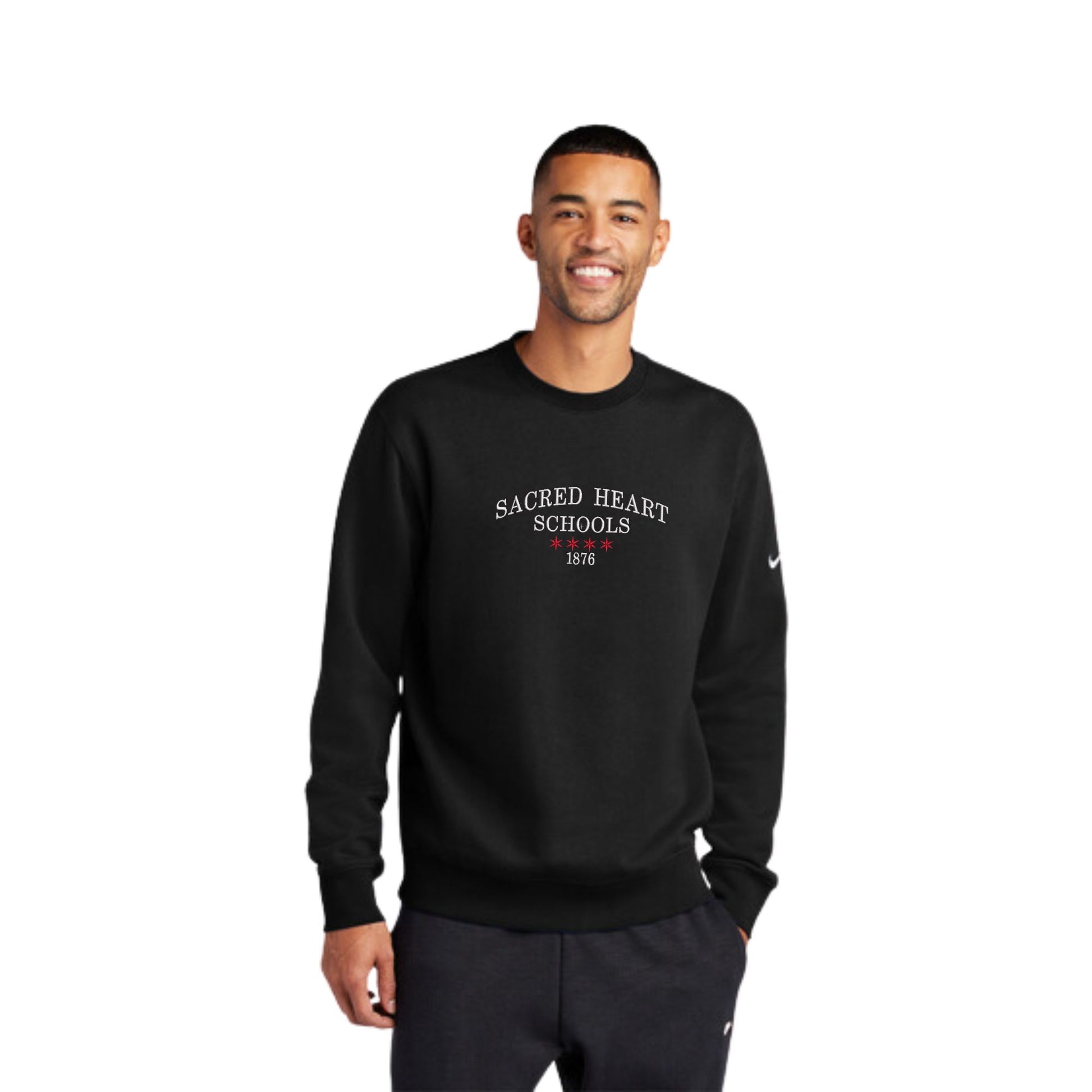 model sample man wearing a black Nike club fleece sleeve swoosh crew with  center chest Sacred Heart Schools embroidered design featuring the Chicago stars