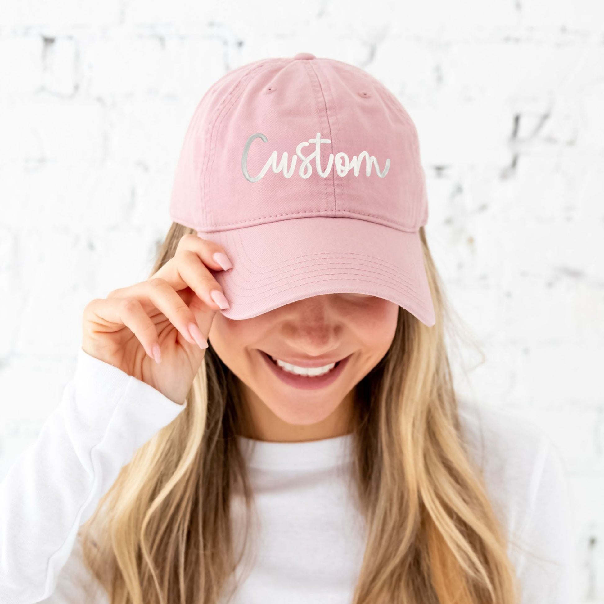 dusty rose baseball hat with custom puff print white embroidered design