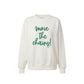 An off-white crewneck sweatshirt featuring the phrase 'move the chains!' printed in green script across the chest, displayed on a clean white background.