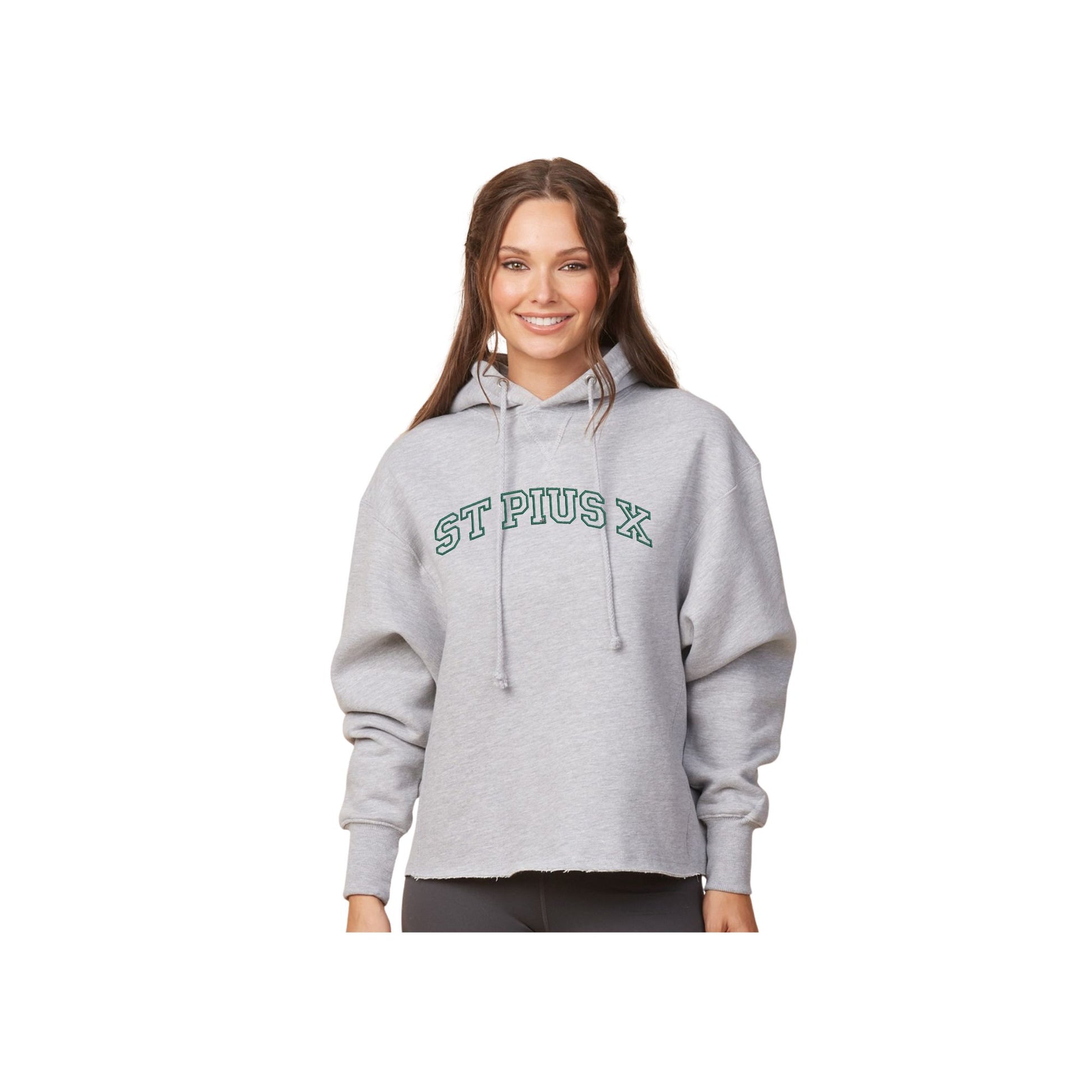 Woman wearing a gray hoodie with 'St. Pius X' text on a white background