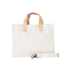White tote bag with beige handles and a strap on a white background