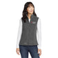 woman wearing a grey fleece eddie bauer vest with custom sacred heart logo embroidered design in red and white thread on the left chest