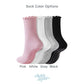 Four pairs of socks in pink, white, gray, and black 