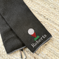 Deep Smoke tri-fold waffle microfiber golf towel with carabiner and custom golf ball/tee and Schoolbook font custom text in white thread embroidered design